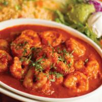Camarones Chipotle · Plump sauteed shrimp simmered in a delicious chipotle sauce. Served with rice, lettuce, toma...