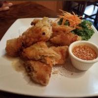 Thai Egg Roll · Deep fried handmade chicken and vegetable egg roll served with Thai sweet and sour sauce.