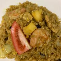 Pineapple Fried Rice · Fried rice in curry powder with chicken, shrimp, pineapple, raisins and egg.