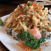 Miami Roll · Fried white fish, avocado, cucumber and tempura flake topped with fried crispy crab meat.