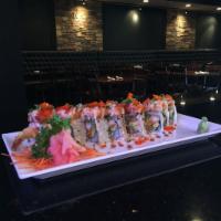Candy Roll · Shrimp tempura, avocado, asparagus and tempura flake topped with cream cheese roll with eel ...