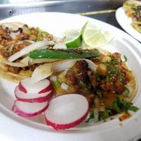 Tacos · A pair of corn tortillas with the meat of your choice topped with cilantro, onions, and salsa.