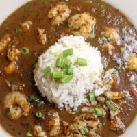 Bowl of Ben's Gumbo · Shrimp and crawfish in a dark roux over white rice.
