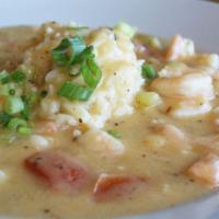 Bowl of Shrimp Etouffee · A New Orleans classic. Seasoned in a creamy roux over white rice.