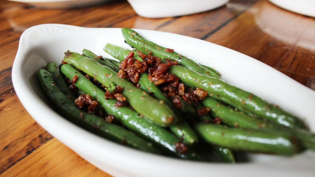 Side Green Beans · Perfectly crispy pan seared green beans with bacon, garlic, and green onions.