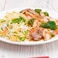 50. Hu Tieu Xao Do Bien · Pan tried chow fun noodles with seafood combo with shrimp, squid, imitation crab and fish me...