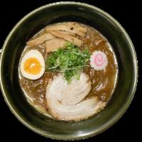 Curry Shoyu Ramen · Soy sauce based broth topped with our house made curry, pork chashu, egg, cabbage/carrot, ba...