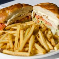 Chicken Sandwich · Grilled chicken, arugula, tomato, fresh mozzarella and pesto mayo on French bread. Served wi...