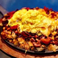 Meat Lover's Skillet · Home fries with chopped bacon, ham, sausage, tomato and cheddar cheese, served with 2 eggs.