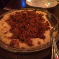 QUESO FUNDIDO · Melted creamy chihuahua cheese topped with your choice of chorizo or rajas poblanas and choi...