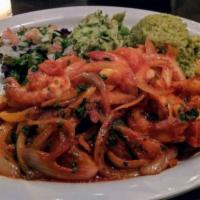 CAMARONES AL TEQUILA · Pan-tossed jumbo shrimp with guajillo adobo, garlic, onion, tomato, cilantro and flambeed wi...