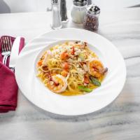 Shrimp Napoli · Imported white shrimp, cherry and sun-dried tomatoes, cannellini beans, asparagus, roasted g...
