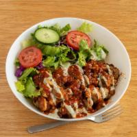 Spicy Chicken Bowl · Our house marinated chicken kabob, served on bed of Turkish rice with salad, spicy and tahin...