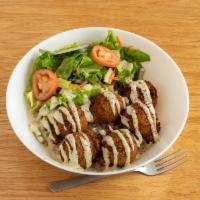 Falafel Bowl · Falafel that's made with garbanzo and fava beans, deep fried and served on bed of Turkish ri...