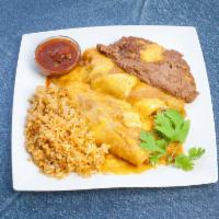 Chicken Enchiladas · Tender pieces of chicken rolled up into 2 tortillas. Covered with enchilada sauce, topped wi...