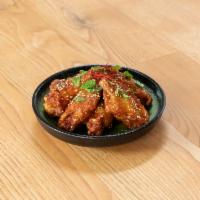 FUYU Chicken Wings · Fried chicken wings with FUYU chili sauce, Sichuan pepper and mint