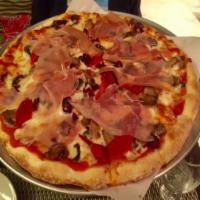 Quattro Stagione Pizza · Mushrooms, roasted peppers, prosciutto, black olives, tomato sauce and mozzarella.
