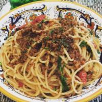 Spaghetti Aglio E Olio · Garlic, extra virgin olive oil and crushed red pepper.