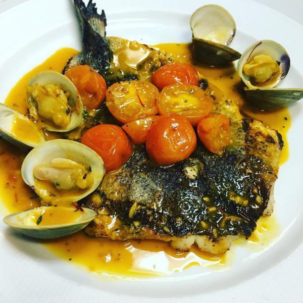 Branzino in Acquapazza · Mediterranean sea bass sauteed with littleneck clams and cherry tomato in a saffron brodetto. Served with a choice of mixed vegetables, Tuscan fries, mashed potatoes or broccoli.
