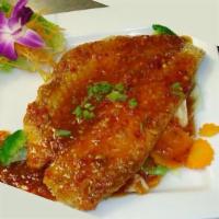 Volcano Fish · Crispy fish topped with tasty spicy sweet chili sauce served on the bed of steamed vegetable...