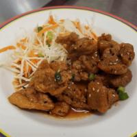 Siam Fried Chicken · Boneless chicken deep-fried with siam special sauce. Cabbage, carrot, scallion, and sesame s...