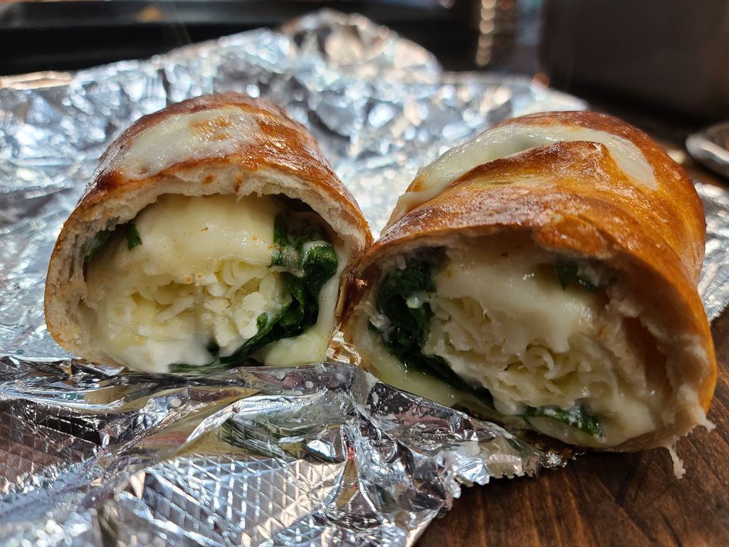 Spinach Roll · Freshly sauteed spinach with Ricotta, Romano and Mozzarella cheeses.