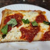 Grandma Sicilian · Thin Crust Fresh Mozzarella pizza with marinara sauce and basil. Makes your mouth water just...