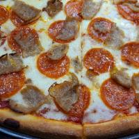 Pepperoni Sausage Pie · Pepperoni and freshly sliced sausage adorn this terrific pie.