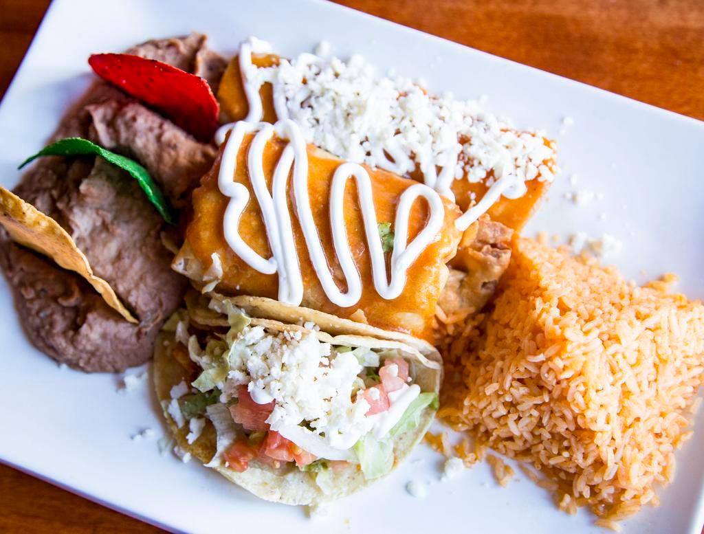 Mexican Combo · Beef mini chimichanga, chicken taco, and a cheese enchilada. Served with Mexican rice and pinto beans.