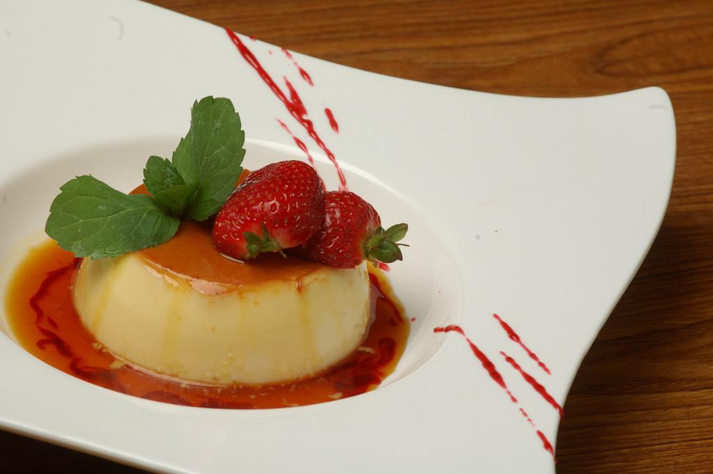 Flan Mexicano · Oven-baked caramel custard dessert made with a top layer of custard paired with the sweetness of a light caramel sauce.