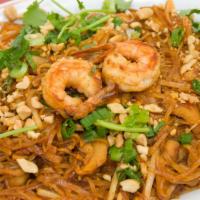 21. Pad Thai Chicken & Prawns · Stir-fried Thai vermicelli noodles with egg, chicken, and prawns, bean sprouts, tofu and gro...