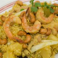 29. Pineapple Fried Rice · Served with prawns, chicken, egg, pineapple, onion, peas, carrots, raisins and cashew nuts.