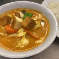 30. Red Curry Tofu · Tofu and mixed vegetables in coconut milk and red curry paste. Spicy.
