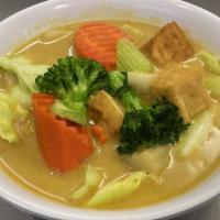 31. Yellow Curry Tofu · Tofu, potatoes and mixed vegetables in coconut milk and yellow curry paste. Spicy.