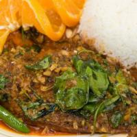 56. Pla Rad Prik · Crispy deep-fried catfish topped with Thai spicy chili garlic sauce and crispy basil leaves....