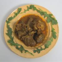 Side of Curry Goat · Cooked Curry Goat served in a container without Rice or Sides