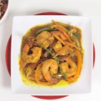 Curry Shrimp · Shrimp simmered in curry sauce with onions and sweet peppers. Served with a rice and peas, w...