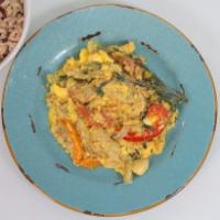Ackee and Salt Fish · Salt fish and ackee sauteed with onions, tomatoes and peppers. Served with a rice and peas, ...