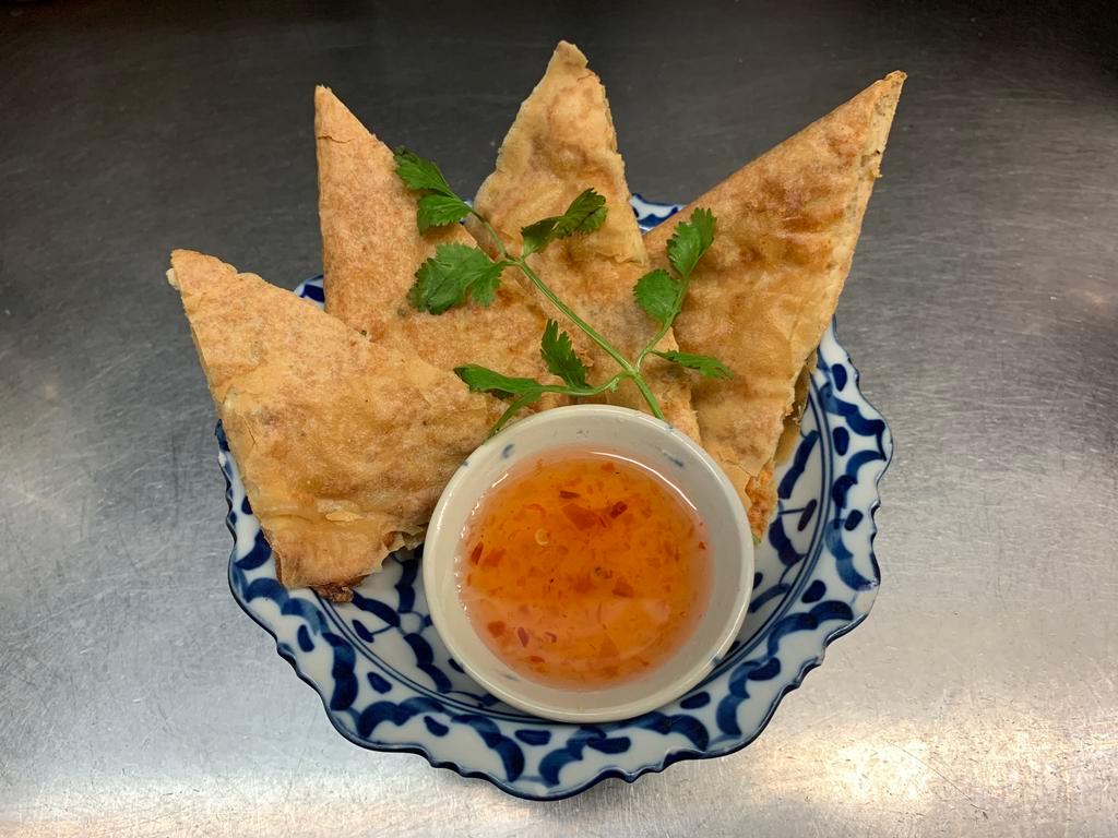 Crispy Shrimp Pancakes (appetizer) · Triangle rice paper stuffed with shrimp and chicken served with plum sauce on the side