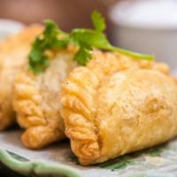 A20. Curry Puff · Minced chicken, potatoes, onion, curry powder with cucumber relish.
