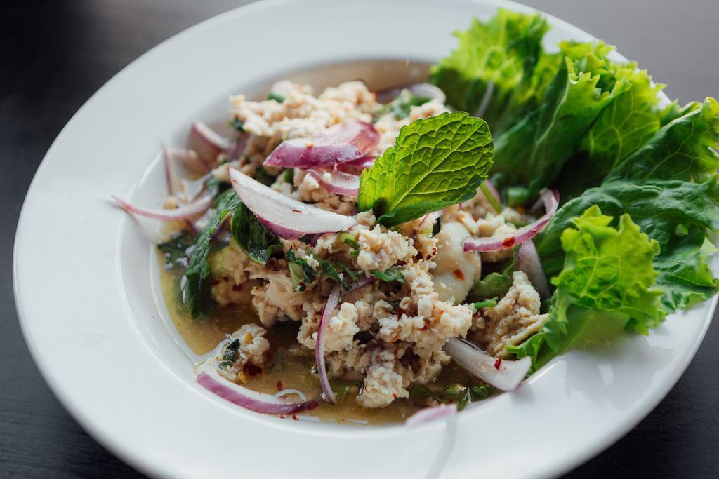 Y8. Larb Chicken Salad · Spicy Thai chicken salad. Minced chicken salad, red onions, mint, scallions, cilantro, grounded toasted jasmine rice and chill lime dressing. Authentic Thai spicy.
