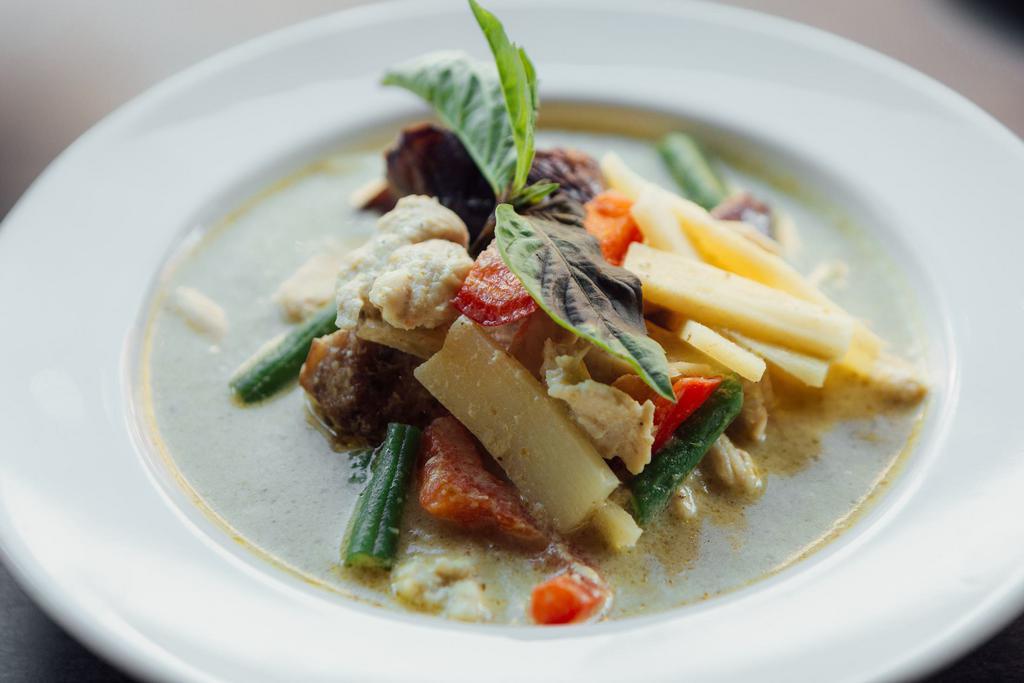 C2. Green Curry · Coconut curry, eggplants, string beans, bell peppers, bamboo shoots and basil leaves. Authentic Thai spicy. Gluten free.