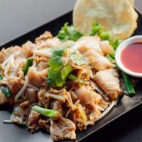 N4. Pad Kua Gai · Stir fried flat rice noodles with chicken, red onion, beansprout, scallion and egg served wi...