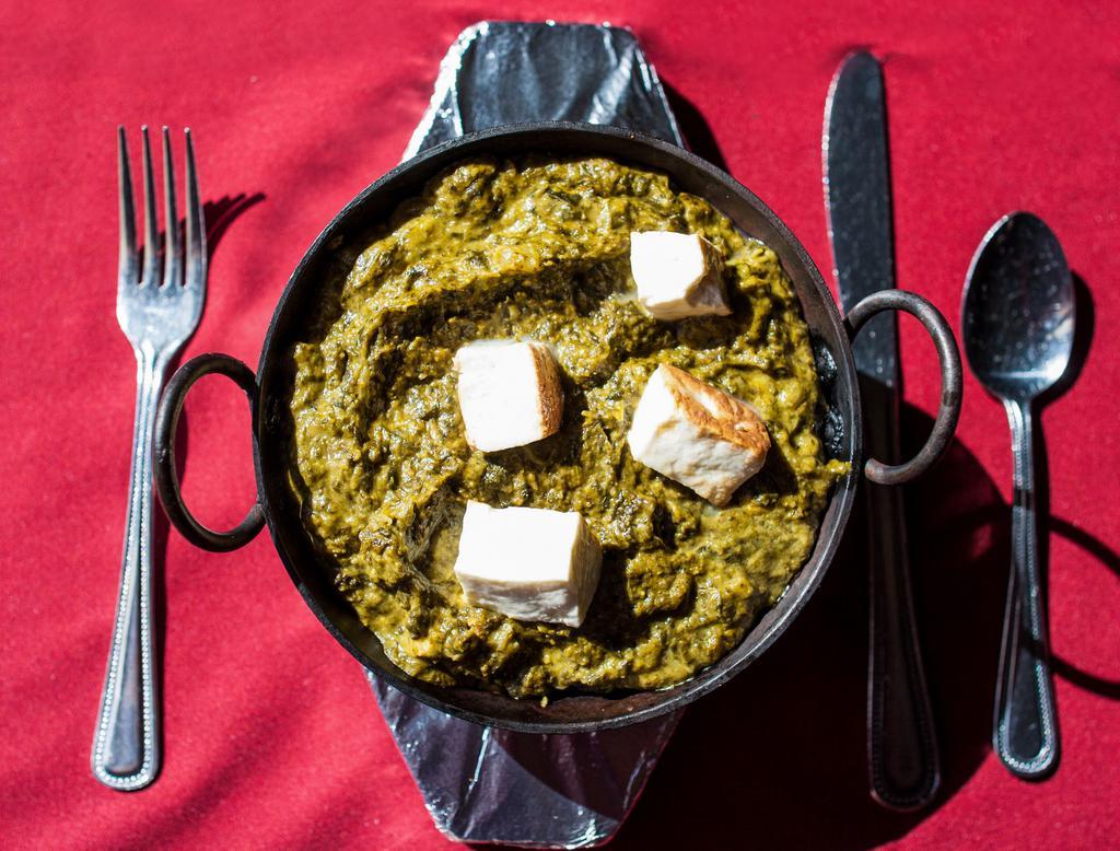 Palak Paneer · Freshly chopped spinach in mild spices and herbs with homemade cottage cheese.