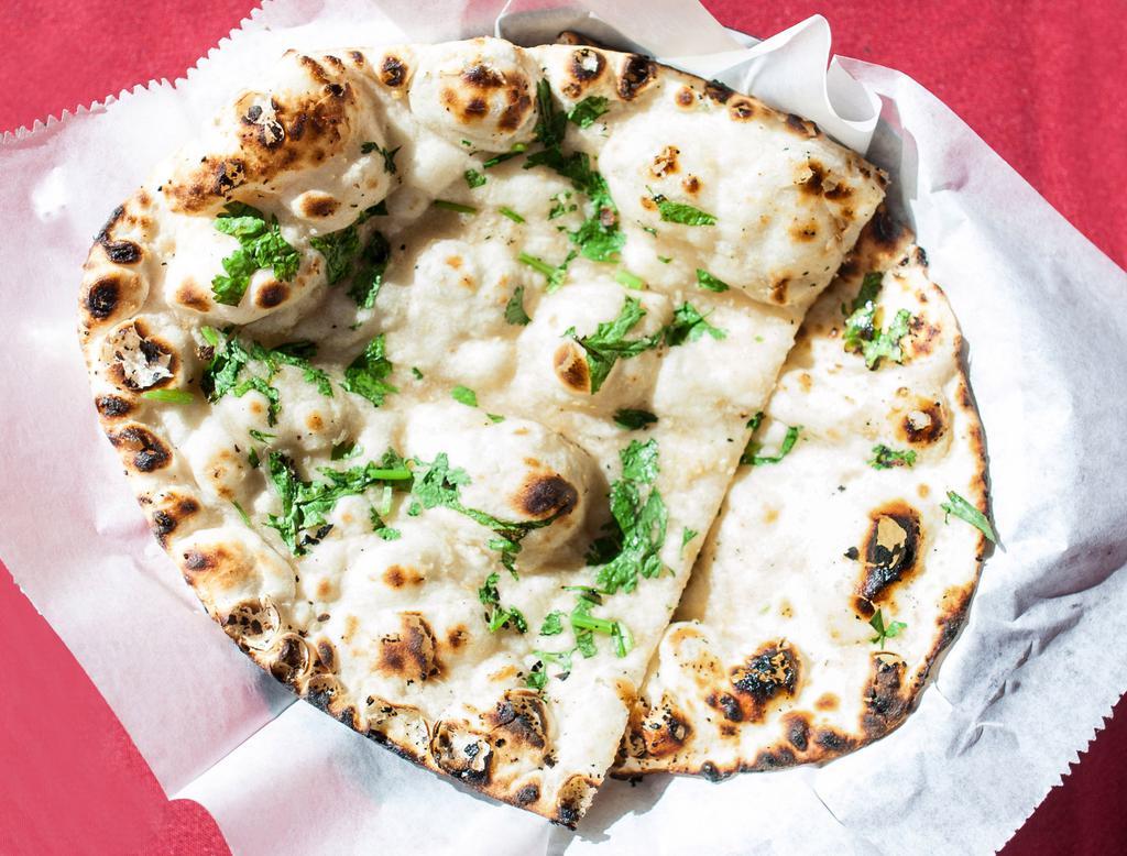 Garlic Naan · Naan with a touch of garlic.