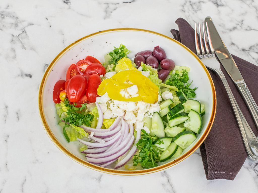 Greek Salad · Romaine hearts, cucumber, tomato, peperoncini, feta cheese, olives, red onion & balsamic dressing. Vegetarian, gluten-free.