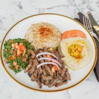 Lamb Gyro Platter · Rice, hummus, Greek salad & tzatziki.