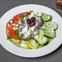 Greek Salad · Fresh garden greens with red onions, green peppers, cucumbers, tomatoes, feta cheese, and Ka...