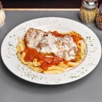 Veal Parmigiana · Lightly fried veal topped with marinara sauce and mozzarella cheese served over your choice ...
