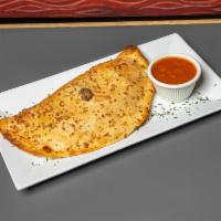 Polpetta Calzone · Homemade meatballs thinly sliced combined with fresh basil leaves, mozzarella cheese, and ma...